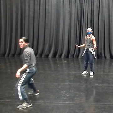 Screenshot of Jon Kim teaching dance exercise with a demonstrator