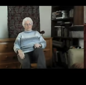 Screenshot of Barbara Lewis sitting in a chair teaching Music In Motion