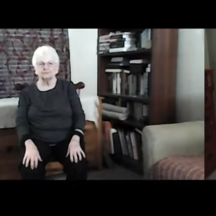 Barbara Lewis sits in a chair for Music in Motion class