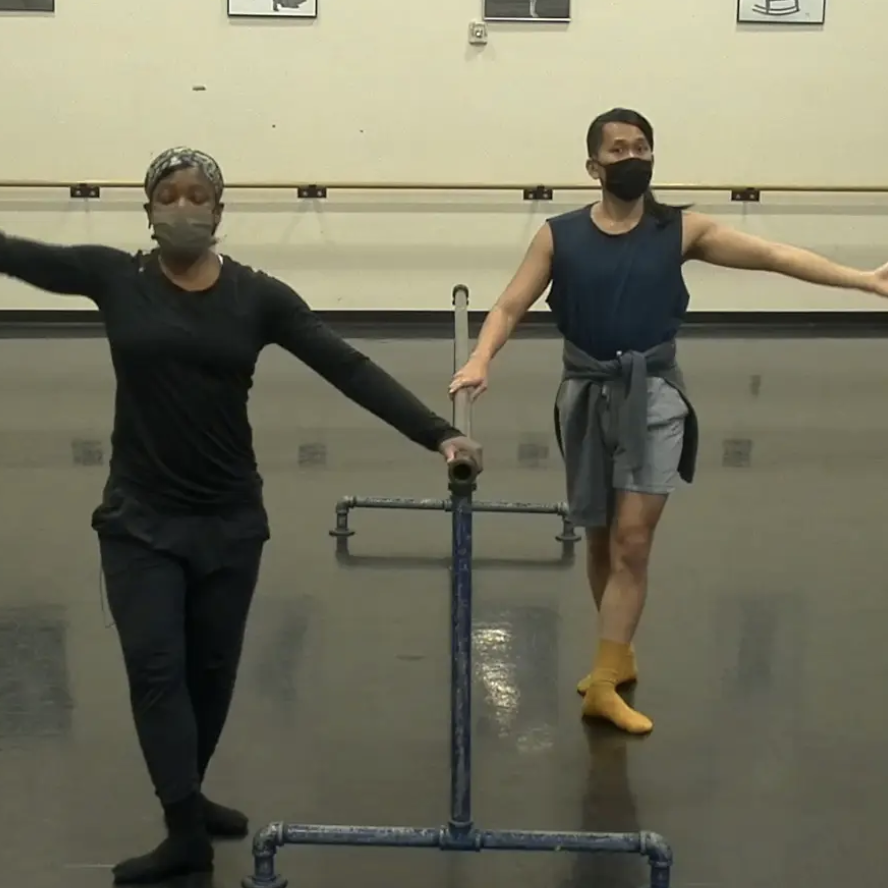 Ursula and Jon stand at the barre for Ballet